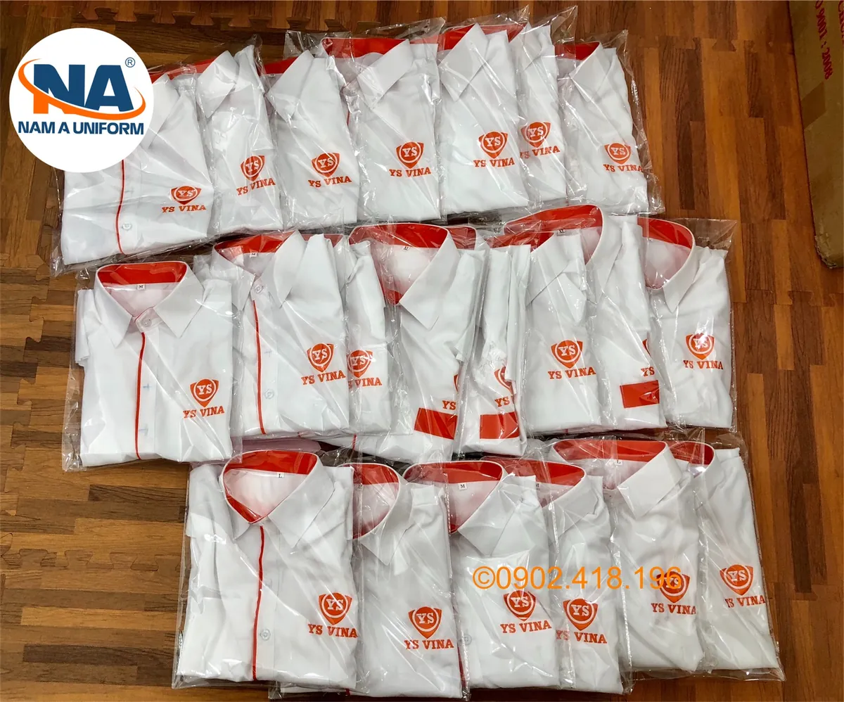 Áo sơ mi trắng phối cam thêu logo YS Vina